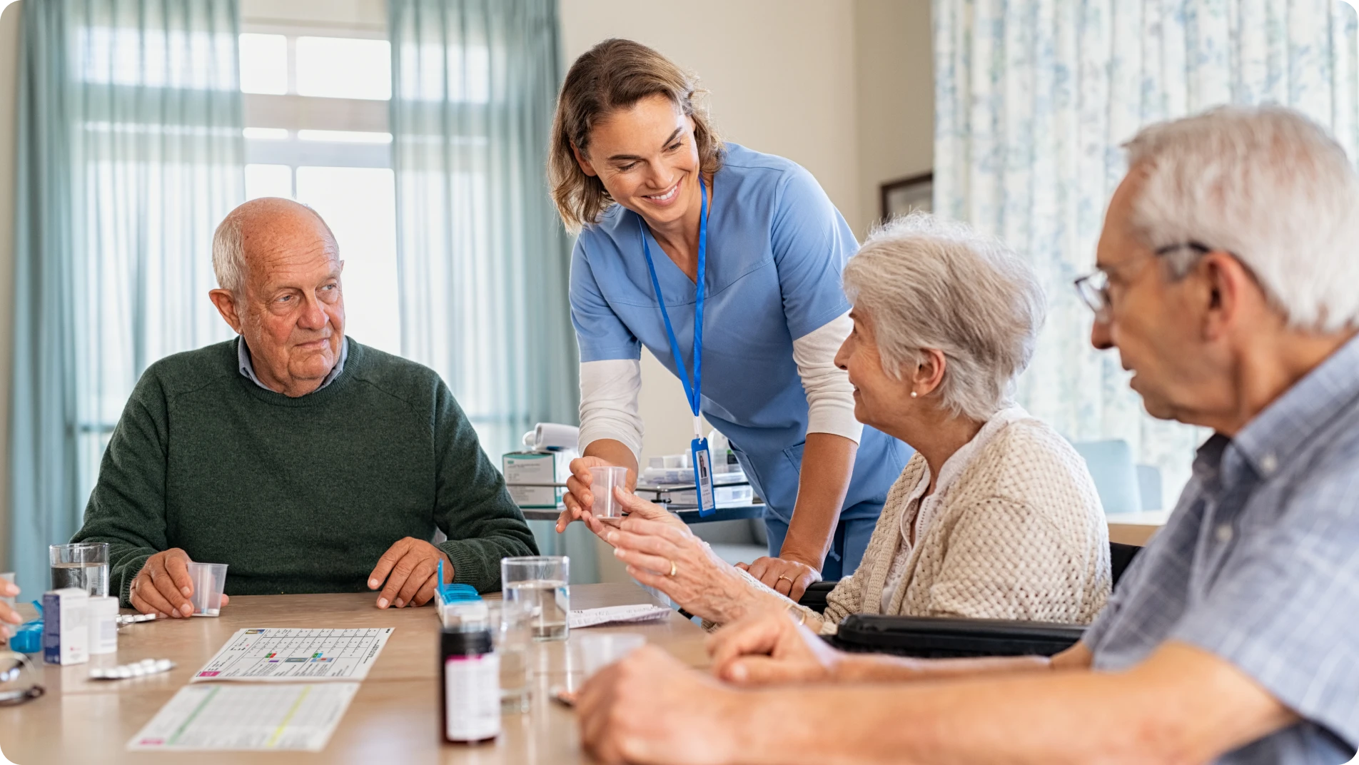 care home worker with two patients